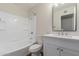 Bright bathroom featuring a shower-tub combo and a vanity with a white countertop at 1322 S Oracle --, Mesa, AZ 85204