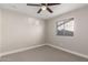 This bedroom offers a ceiling fan and a view through the window at 1322 S Oracle --, Mesa, AZ 85204