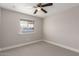 Neutral bedroom featuring a ceiling fan, neutral walls and carpet and a window at 1322 S Oracle --, Mesa, AZ 85204