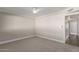 This bedroom features neutral carpet, a ceiling fan, and base trim molding throughout at 1322 S Oracle --, Mesa, AZ 85204