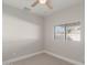 This bedroom offers neutral walls, soft carpet and a ceiling fan at 1322 S Oracle --, Mesa, AZ 85204