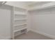 This walk-in closet features built in shelving and carpeted flooring for optimal storage at 1322 S Oracle --, Mesa, AZ 85204