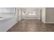 Dining room featuring wood-look floors and a modern light fixture at 1322 S Oracle --, Mesa, AZ 85204