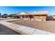 Picture of a well-maintained single-story brick home with a convenient carport and tidy landscaping at 1322 S Oracle --, Mesa, AZ 85204