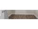 Hallway features neutral walls, base trim and wood-look tile flooring at 1322 S Oracle --, Mesa, AZ 85204
