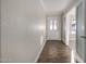 Bright foyer showcasing wood-look tile flooring and a welcoming front door with sidelights at 1322 S Oracle --, Mesa, AZ 85204