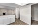 Bright kitchen with a breakfast bar featuring quartz counters and white cabinets at 1322 S Oracle --, Mesa, AZ 85204