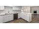 Modern kitchen with white cabinets, quartz counters, and stainless steel dishwasher at 1322 S Oracle --, Mesa, AZ 85204