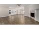 Spacious living room showing a fireplace, seamlessly connected to the kitchen and dining spaces at 1322 S Oracle --, Mesa, AZ 85204