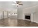 A spacious living area featuring a fireplace and an open layout to the dining area at 1322 S Oracle --, Mesa, AZ 85204