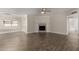 Bright and airy living room showing a fireplace and neutral decor with wood-look flooring at 1322 S Oracle --, Mesa, AZ 85204