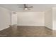 Open-concept living room with a ceiling fan and lots of natural light at 1322 S Oracle --, Mesa, AZ 85204