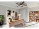 This home office features a desk, built in shelving, overhead lighting, and natural sunlight at 1322 S Oracle --, Mesa, AZ 85204