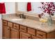 Bathroom vanity with granite countertop, storage and decor at 13434 W El Sueno Ct, Sun City West, AZ 85375