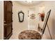 Inviting foyer with tile flooring, decorative mirror, and artful accents at 13434 W El Sueno Ct, Sun City West, AZ 85375