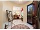Entryway featuring tile flooring, decorative accents, and a view to the dining room at 13434 W El Sueno Ct, Sun City West, AZ 85375