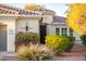 Charming home exterior with a tile roof, manicured landscaping, and decorative front door at 13434 W El Sueno Ct, Sun City West, AZ 85375