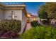 Home featuring a welcoming front entrance, desert landscaping, and exterior lighting at 13434 W El Sueno Ct, Sun City West, AZ 85375