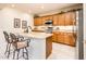 Charming kitchen featuring granite countertops, stainless steel appliances, and tile flooring at 13434 W El Sueno Ct, Sun City West, AZ 85375