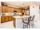 Well-lit kitchen with granite countertops, stainless steel appliances, and ample cabinetry at 13434 W El Sueno Ct, Sun City West, AZ 85375
