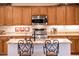 Stylish kitchen featuring stainless steel appliances, granite countertops, and custom cabinetry at 13434 W El Sueno Ct, Sun City West, AZ 85375