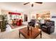 Open concept living room and dining area with tile flooring and natural light at 13434 W El Sueno Ct, Sun City West, AZ 85375