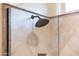 Shower featuring rainfall shower head and decorative tile at 13434 W El Sueno Ct, Sun City West, AZ 85375