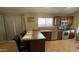 Kitchen featuring stainless steel appliances, a breakfast bar, and tile flooring at 1546 E Falcon Ct, Casa Grande, AZ 85122