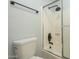Bathroom with a walk-in shower with white tiles and black fixtures at 15801 N 29Th St # 11, Phoenix, AZ 85032