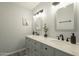 Bathroom showcasing a dual vanity with granite countertops, modern faucets, and updated lighting at 15801 N 29Th St # 11, Phoenix, AZ 85032