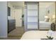 Bedroom showcasing mirrored closet doors, dresser, and an inviting neutral color palette at 15801 N 29Th St # 11, Phoenix, AZ 85032