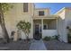 Home exterior featuring stucco, gated courtyard, desert landscaping, and covered porch at 15801 N 29Th St # 11, Phoenix, AZ 85032