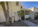 Two story stucco exterior with desert landscaping and gated front porch entry at 15801 N 29Th St # 11, Phoenix, AZ 85032