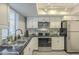 Well-lit kitchen with black appliances and sleek countertops at 15801 N 29Th St # 11, Phoenix, AZ 85032