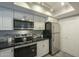 Kitchen with stainless steel appliances and white cabinets at 15801 N 29Th St # 11, Phoenix, AZ 85032