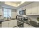 Kitchen featuring stainless steel appliances and black countertops at 15801 N 29Th St # 11, Phoenix, AZ 85032