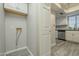 Functional laundry room with washer hookups, cabinets, and vinyl flooring at 15801 N 29Th St # 11, Phoenix, AZ 85032
