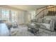 Inviting living room with stylish furnishings, decor, and staircase at 15801 N 29Th St # 11, Phoenix, AZ 85032