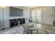 Cozy living room with stylish decor, TV, and access to outdoor patio at 15801 N 29Th St # 11, Phoenix, AZ 85032