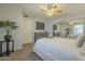Relaxing main bedroom offering a ceiling fan, window view, and modern decor at 15801 N 29Th St # 11, Phoenix, AZ 85032