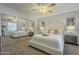 Spacious main bedroom featuring a ceiling fan, mirrored closet, and neutral decor at 15801 N 29Th St # 11, Phoenix, AZ 85032