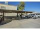 Designated covered parking spot for residents, with two SUVs parked nearby on a clear day at 15801 N 29Th St # 11, Phoenix, AZ 85032