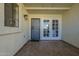 Covered patio featuring tiled flooring, metal security door, and paneled glass doors at 15801 N 29Th St # 11, Phoenix, AZ 85032