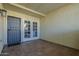 Covered patio featuring tiled flooring, metal security door, and paneled glass doors at 15801 N 29Th St # 11, Phoenix, AZ 85032