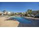 Inviting community pool surrounded by lush landscaping and residences at 15801 N 29Th St # 11, Phoenix, AZ 85032