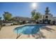 Inviting pool surrounded by lush landscaping, residences, and ample sunlight at 15801 N 29Th St # 11, Phoenix, AZ 85032