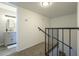 Staircase leading to a bathroom with a granite vanity and a large framed mirror at 15801 N 29Th St # 11, Phoenix, AZ 85032