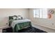 Cozy bedroom with natural light, plush carpet, and light colored walls at 16918 W Statler St, Surprise, AZ 85388