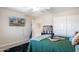 Bedroom with neutral walls, a queen size bed, and a flat-screen TV at 16918 W Statler St, Surprise, AZ 85388