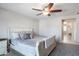 Bright bedroom featuring a ceiling fan and neutral tones, creating a cozy and inviting atmosphere at 16918 W Statler St, Surprise, AZ 85388